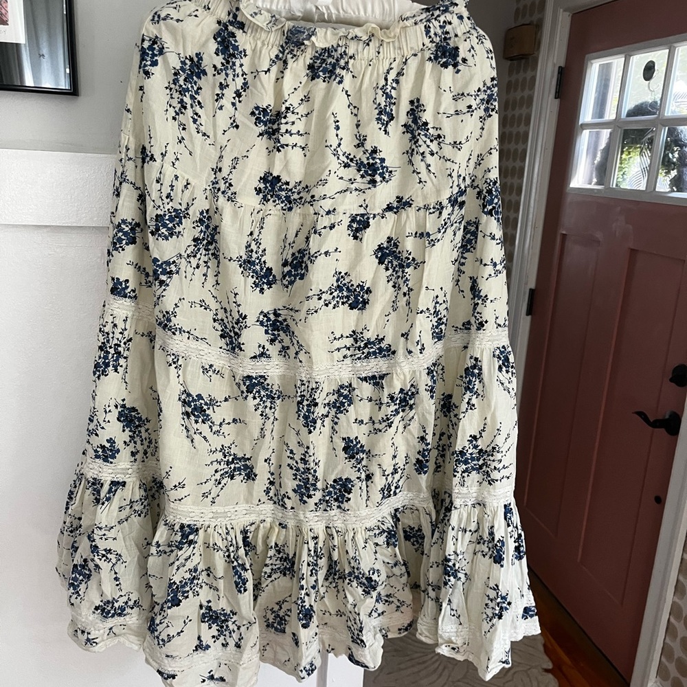 THE GREAT. Cream Maxi Skirt with Navy Floral Print